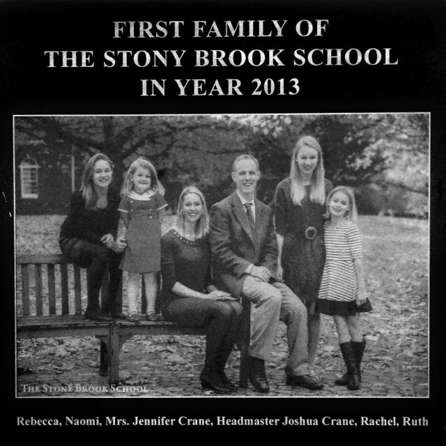 Engraving of a mother and father posing with their four children on a bench for a photograph on a panel at the Maze of Honor