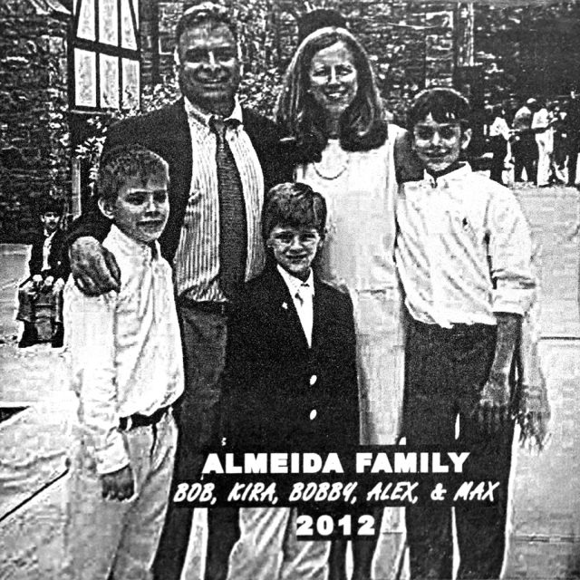 Engraving of a husband and wife with their three sons on a panel at the Maze of Honor