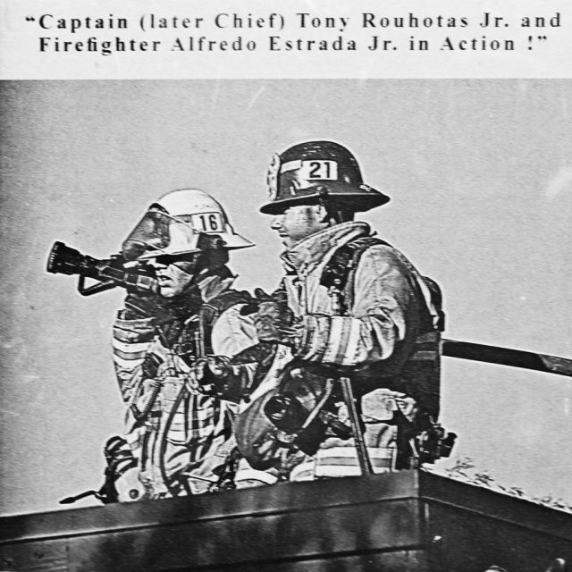 Engraving of two firefighters fully outfitted and in action