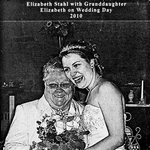 A bride hugs her grandmother on her wedding day