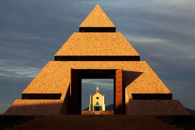 The open doors of the Center of the World pyramid revealing the Church on the Hill