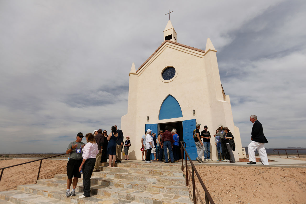 People congregating on the steps and in front of the Church on a Hill at the History of Humanity in Granite museum