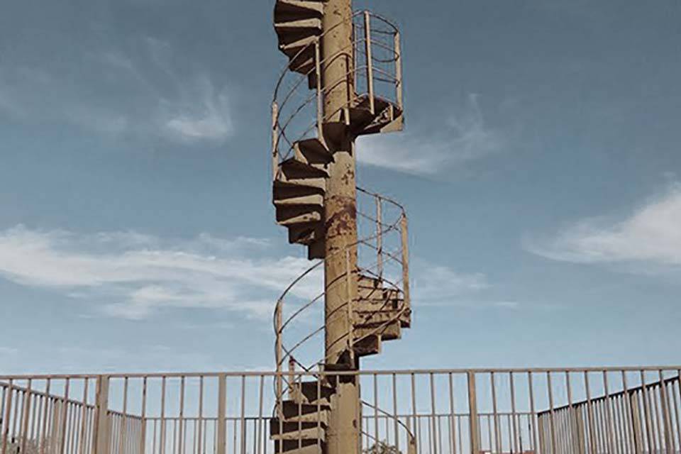Rusted spiral stairs which were a section of the original stairway of the Eiffel Tower