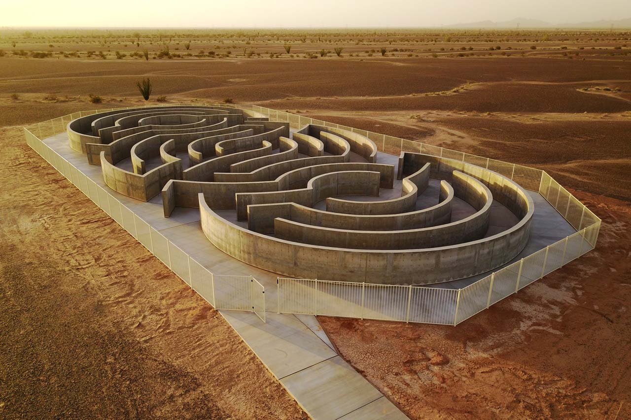 Winding paths of the Maze of Honor surrounded by a white metal fence in the desert near Yuma, Arizona